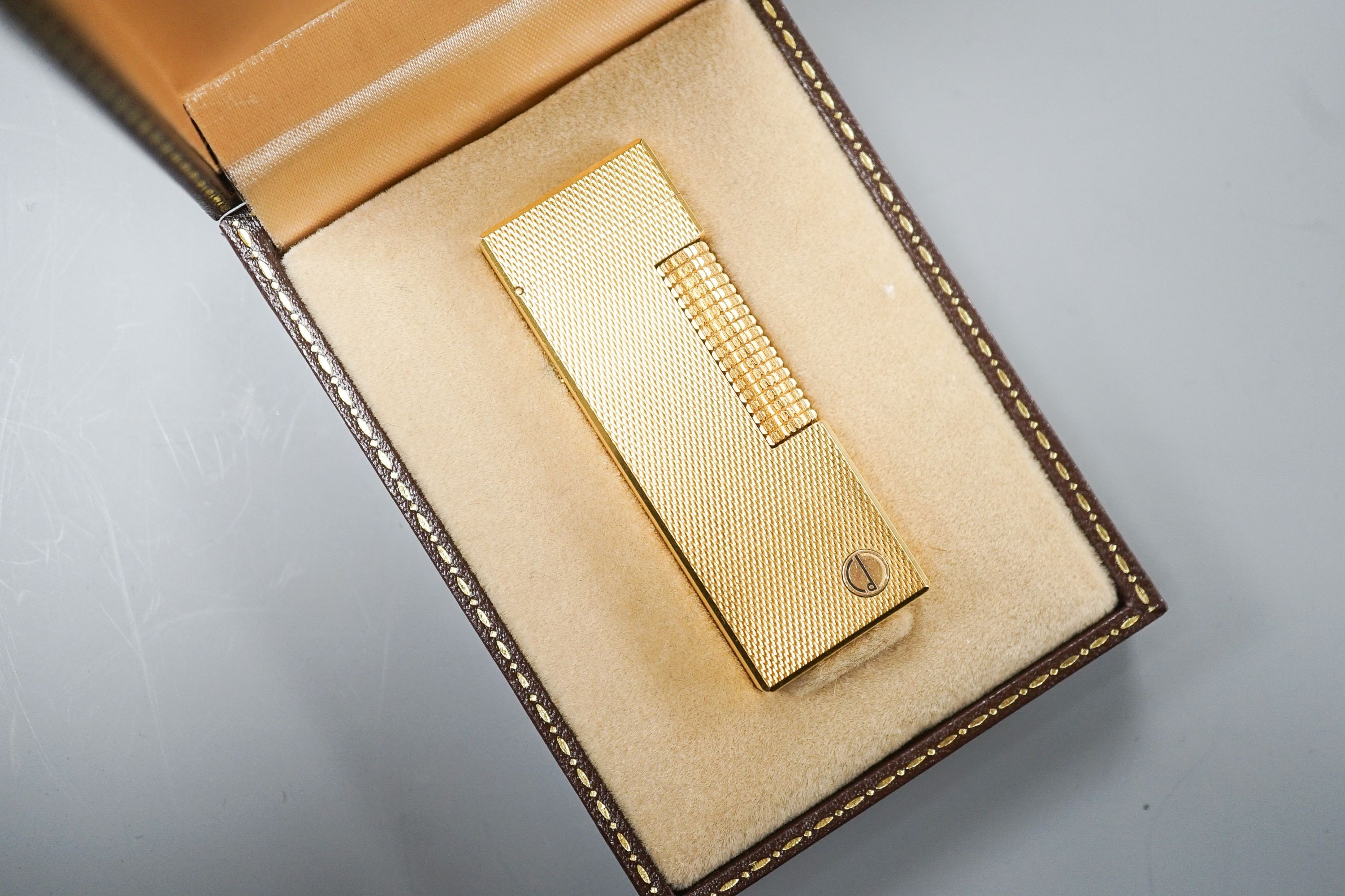 A cased Dunhill gold plated lighter